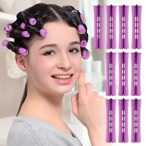 Ten pink non-slip hair perm rods for creating short curls in natural hair, secured with elastic rubber bands.