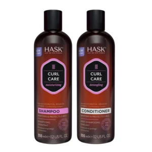 HASK Curl Care shampoo and conditioner set with coconut and argan oil hydrates and strengthens curly hair, gently removing buildup without stripping natural oils.
