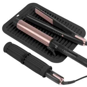 Large heat resistant silicone mat protects surfaces from hot hair tools like flat irons and curling irons, featuring a velcro strap for easy storage and a hanging hole for space-saving.