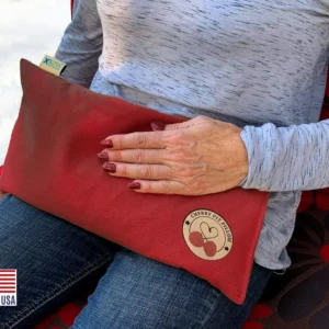 Henna red microwavable cherry pit heating pad provides moist heat therapy for neck, muscles, joints and menstrual cramps.