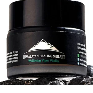 A jar of pure Himalayan Shilajit resin, a potent rejuvenator sourced from 16000 feet, known for its anti-aging properties.