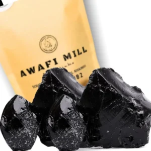 Dark brown Himalayan Shilajit resin chunks from Awafi Mill, ready to dissolve in warm water for a natural mineral supplement.