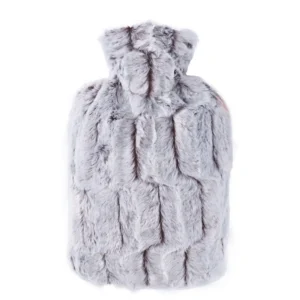 A brown and silver Hugo Frosch hot water bottle with a soft faux fur cover, made in Germany with over 90% renewable resources and TUV tested.