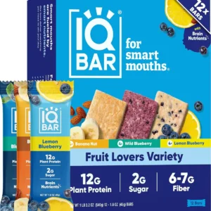 A box of IQ BAR fruit lover's variety pack brain and body protein bars, a keto, paleo-friendly, and vegan snack with 11g of plant protein, only 1g of sugar, and 4g net carbs, featuring lemon blueberry, banana nut, and blueberry flavors.