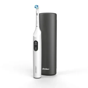 Dark grey Jordan Clean Smile electric toothbrush with travel case, featuring pressure sensor, 2 speed modes, and USB charging.