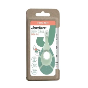 The Jordan Green Clean baby toothbrush for ages 0-2 features extra soft, bio-based bristles, a handle made from recycled plastic, and a soft biting ring, designed for establishing healthy dental habits.