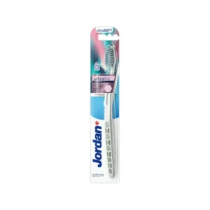 A lightweight Jordan Ultralite Sensitive toothbrush with ultrasoft bristles, designed to be gentle on gums and reduce plastic waste.