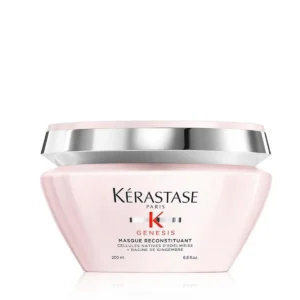A jar of Kérastase Genesis Reconstituant hair mask designed to intensely nourish, detangle, and reinforce dry, weakened hair, reducing hair fall due to breakage and leaving it soft and shiny.