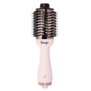 L'ANGE 2-in-1 titanium hair dryer brush in blush pink for creating smooth, voluminous, or curled hairstyles on all hair types.