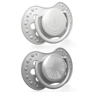 Two grey Lovi Dynamic Harmony soothers for boys aged 6-18 months with dynamic silicone teat that supports natural sucking reflex and prevents bite interference.