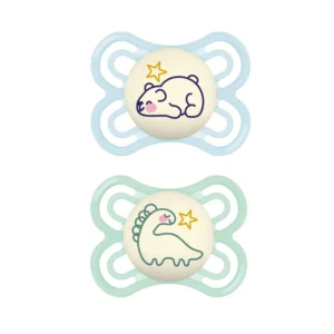 Two MAM glow in the dark pacifiers for babies 0-6 months, designed with a SkinSoft nipple, in a self-sterilizing case, are perfect for breastfed babies and easy to find at night.