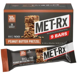 A box of nine Met-Rx Big 100 Colossal protein snack bars for post workout muscle recovery.