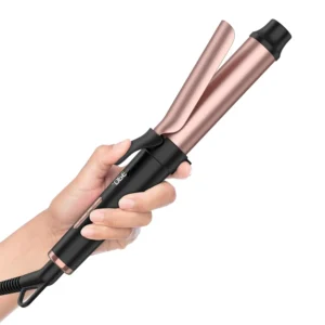 This travel size mini curling iron is perfect for creating curls on the go, featuring dual voltage, fast heating, ceramic coating, five heat settings and an LCD display.