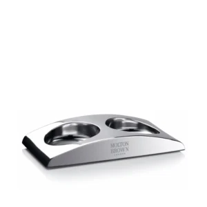 Sleek stainless steel Molton Brown Elemental Arc hand wash holder designed to elegantly display hand wash and lotion bottles in your bathroom or kitchen.