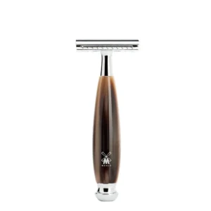 Close-up of the MÜHLE VIVO safety razor with a brown horn resin handle and chrome accents, showcasing its classic closed comb design for a clean and comfortable shave.
