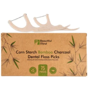 This kraft paper box contains 75 natural dental floss picks made with bamboo charcoal thread and vegan cornstarch handles for effective, eco-friendly teeth cleaning.