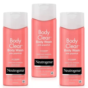 Three bottles of Neutrogena Body Clear Pink Grapefruit acne body wash with salicylic acid, designed to fight breakouts on the back, chest, and shoulders.
