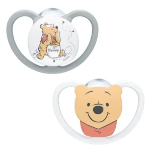 Two BPA-free NUK Space baby dummies featuring a Winnie the Pooh design, created with extra-large air openings for sensitive skin and promoting healthy oral development in babies aged 6-18 months.