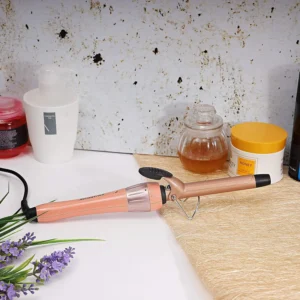 Black Olsenmark hair curler featuring wide heating plates and a 360-degree swivel cord for easy styling with on/off switch.