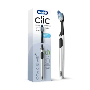 Oral-B Clic reusable toothbrush in Onyx Silver with X-shaped bristles and a magnetic holder for hygienic storage.