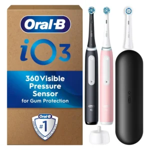 This image shows a pink and black Oral-B iO 3 electric toothbrush dual pack with three brush heads and a travel case, designed by Braun, offering healthier gums in one week with advanced technology and a pressure sensor.
