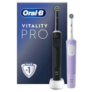 Two Oral-B Vitality Pro electric toothbrushes, one black and one purple, with brush heads and charger, offering daily clean, sensitive, and sensitive plus modes for gentle yet effective plaque removal.
