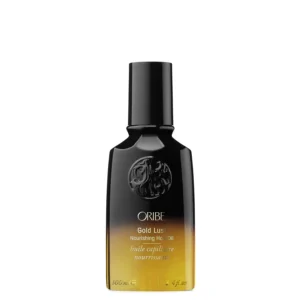 A bottle of Oribe Gold Lust Nourishing Hair Oil, a luxuriously light oil that instantly restores hair.