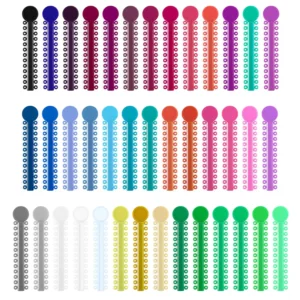 A colorful assortment of OSGP orthodontic ligature ties, also known as o-rings or braces rubber bands, used in dental braces to hold the archwire in place and available in 40 different colors.