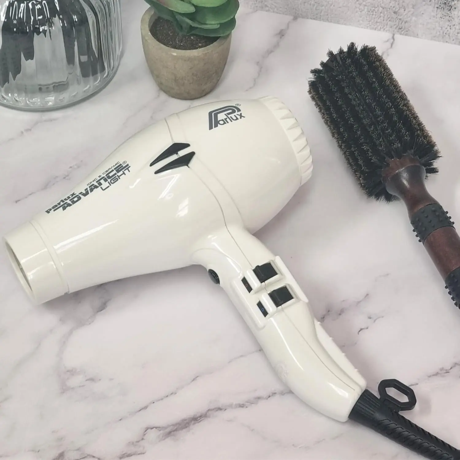 The Parlux Advance white hair dryer features ionic and ceramic technology, multiple speed and heat settings, and a cool shot button for achieving healthy, static-free hair.
