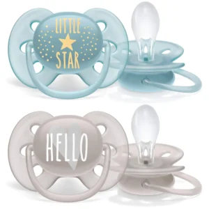 A two-pack of blue and grey Philips AVENT ultra soft pacifiers designed for babies aged 6-18 months, featuring flexible shields to prevent skin irritation and symmetrical teats for natural oral development.
