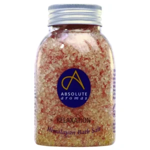 A jar of pink Himalayan bath salts infused with clary sage, petitgrain, chamomile, and lavender essential oils for a relaxing and detoxifying aromatherapy bathing experience.