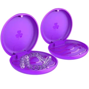 This image shows a set of two purple, solid retainer cases, perfect for storing orthodontic retainers and mouthguards, with a unique design and a secure seal.