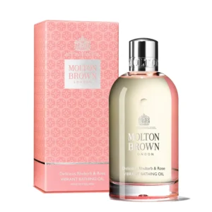 Molton Brown Delicious Rhubarb & Rose bathing oil infused with argan oil and rhubarb extract, promising to soothe and scent skin while elevating self-care with a radiant glow.