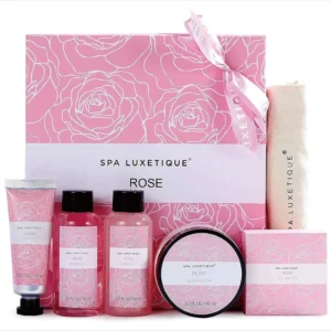 This rose travel spa kit for women features six rose-scented bath and body products, including lotion, shower gel, bubble bath and soaps, all packaged in a reusable burlap travel bag, perfect for a nourishing, on-the-go self-care experience.