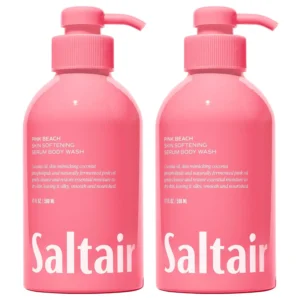 Two bottles of Saltair Pink Beach body wash, a vegan and cruelty-free formula with coconut oil and a delightful coconut, almond blossom, and vanilla fragrance for soft, smooth, and nourished skin.
