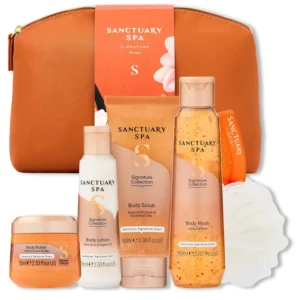 Sanctuary Spa Signature Collection gift set with body wash, scrub, lotion, butter, and puff, a vegan self-care treat in a travel-friendly bag.