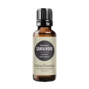Bottle of Edens Garden Hawaiian Sandalwood essential oil, steam-distilled for a rich, sweet, and tranquil aroma perfect for relaxation and aromatherapy.