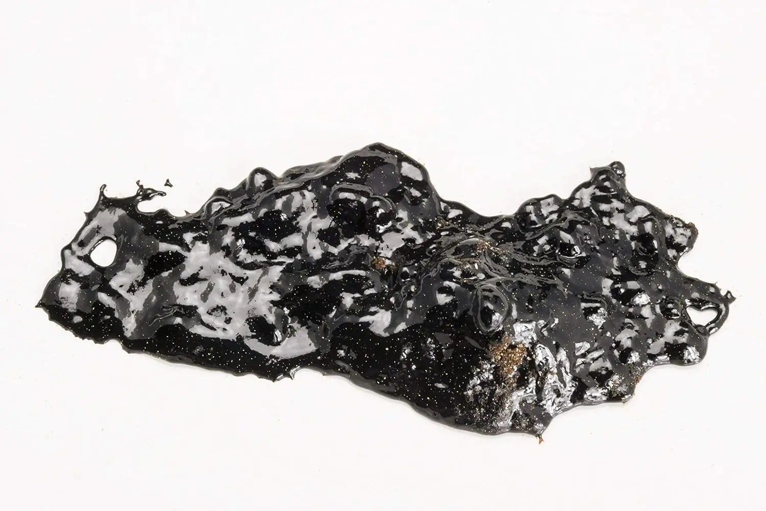 This image displays a bottle of Dragon Herbs High Mountain Shilajit capsules, a dietary supplement sourced from a Di Tao certified authentic location.