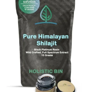 Close-up of Holistic Bin black platinum shilajit resin, a mineral-rich supplement containing fulvic acid, humic acid, and trace minerals, shown with the included serving spoon.