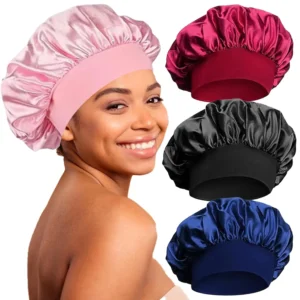 Four silk hair bonnets with adjustable drawstrings for sleeping, designed to protect hair from frizz and damage while providing a comfortable and breathable fit.