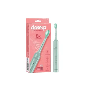 Green closeup Sonic Expert rechargeable electric toothbrush provides 8x plaque removal and features whitening, clean, and sensitive modes for complete oral care.