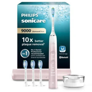 Philips Sonicare DiamondClean 9000 electric toothbrush in pink, designed to remove plaque and improve gum health, comes with four premium plaque defense brush heads.