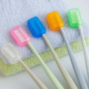 Five colorful AMERTEER toothbrush head covers protect manual toothbrushes and keep them hygienically clean during travel, camping, or daily use.