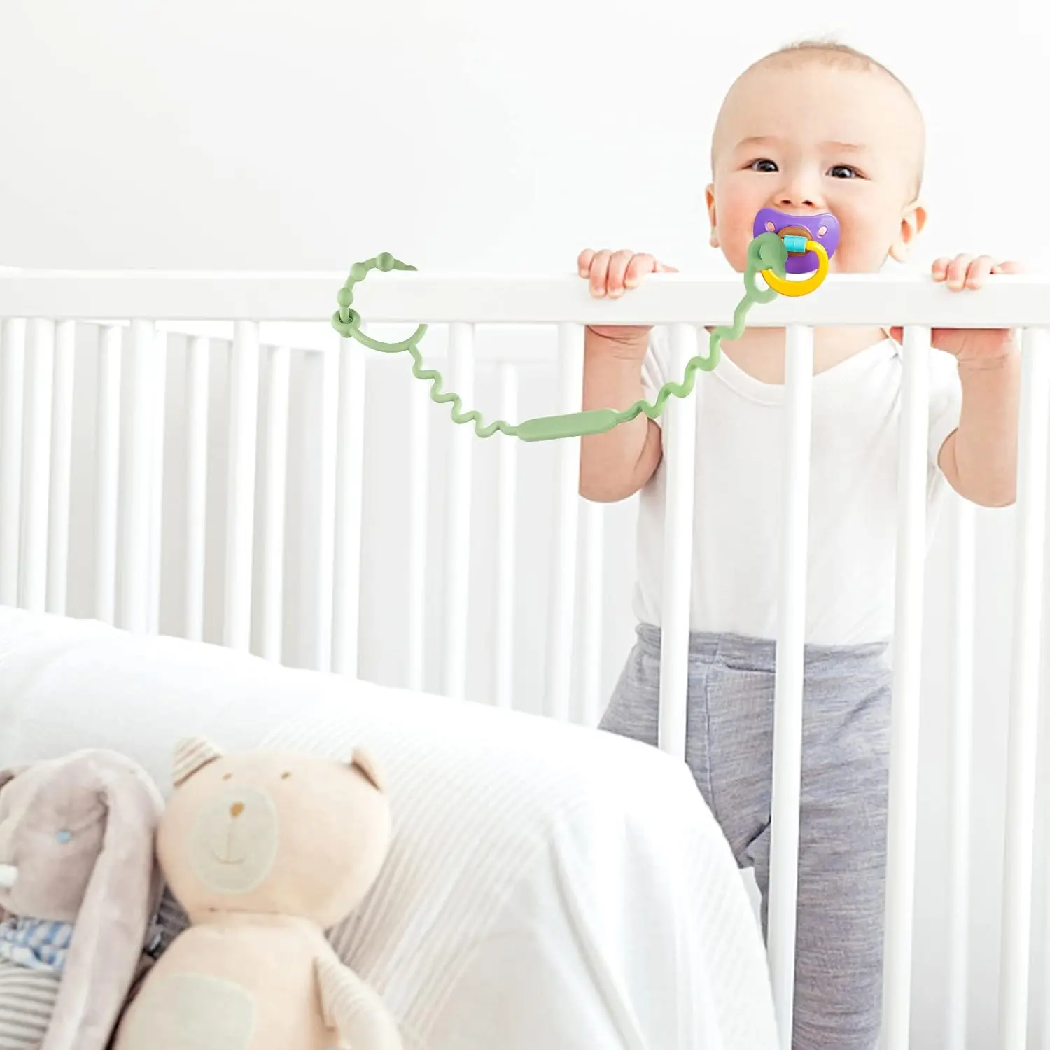 Five colorful, adjustable silicone toy straps for baby are displayed, demonstrating how they securely attach a teether, sippy cup, and other toys to a stroller, keeping them clean and off the ground.