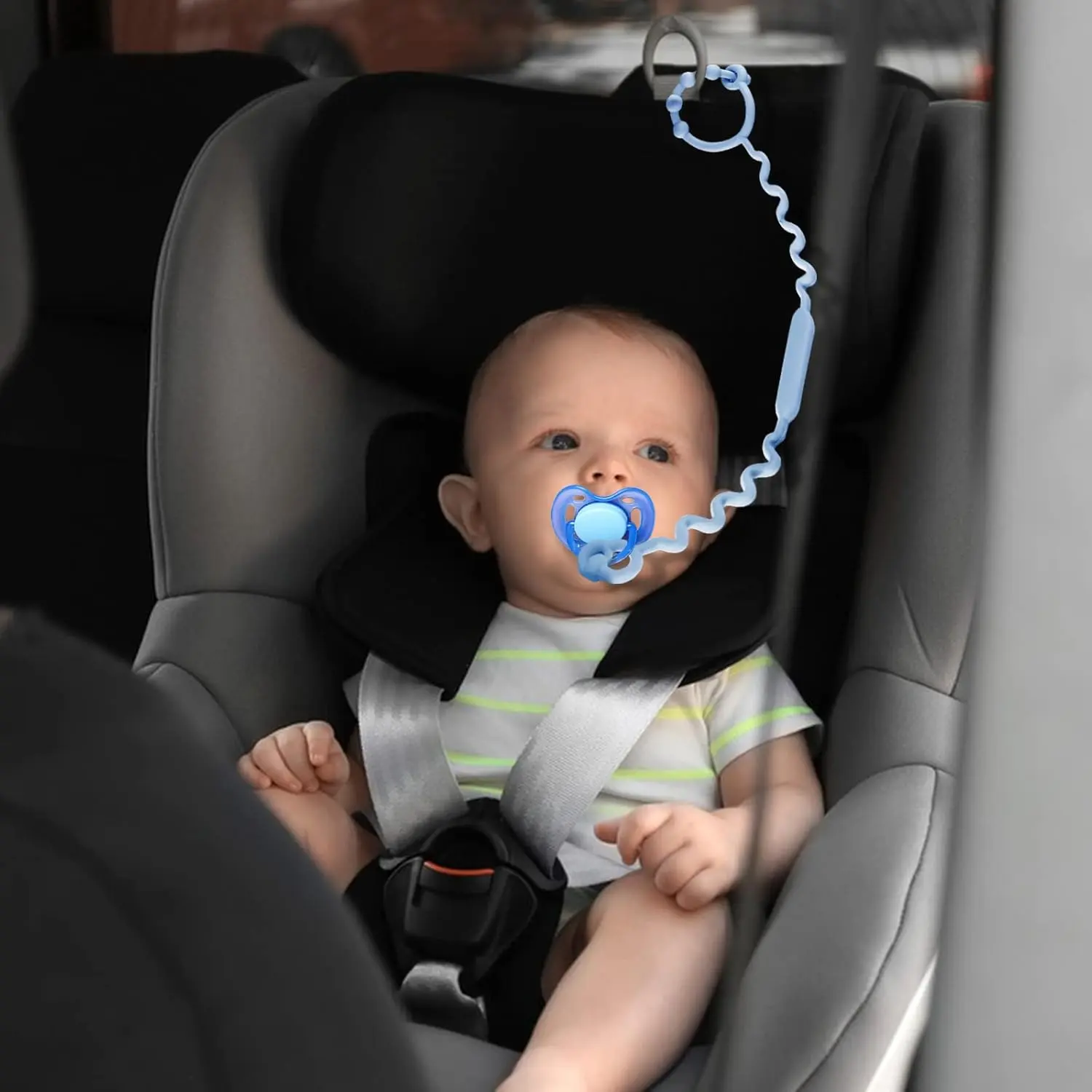 Five colorful, adjustable silicone toy straps for baby are displayed, demonstrating how they securely attach a teether, sippy cup, and other toys to a stroller, keeping them clean and off the ground.