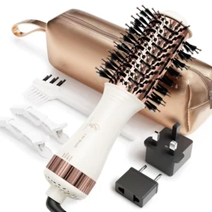 The dual voltage travel blow dryer brush features nano titanium technology and is perfect for styling hair on the go with its one-step design.