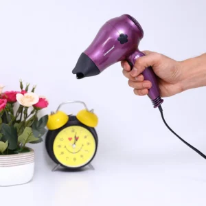 Compact and portable Olsenmark travel hair dryer with a foldable handle, cool shot function, and 1200W power for salon-style, frizz-free hair on the go.