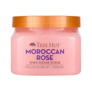 A jar of Tree Hut Moroccan Rose Shea Sugar Scrub provides gentle exfoliation and intense moisturization, leaving skin soft, smooth, and hydrated.