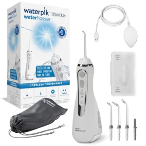 White Waterpik cordless water flosser with three pressure settings and USB charger, ideal for travel and removing plaque, promoting healthier gums and cleaner teeth.