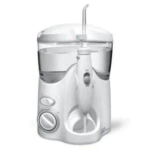 White Waterpik Ultra Water Flosser with flossing tips, featuring pulse modulation for plaque removal and enhanced gum stimulation.